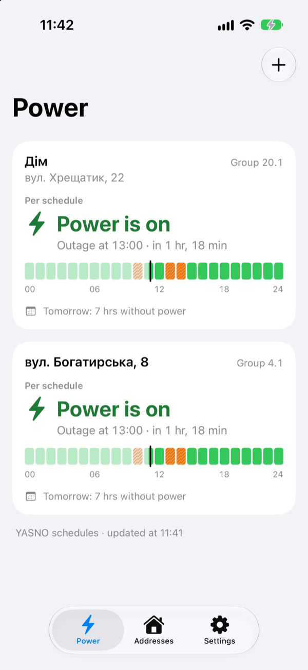 The Power screen with two Kyiv addresses: “Дім” (home) on Khreshchatyk Street, and one on Bohatyrska Street. Both have power per the schedule and the next outage at 13:00; each shows a strip of the day and a note: 7 hours without power tomorrow.